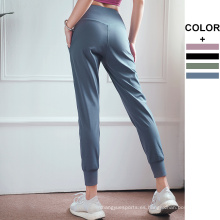 Pantalones de cintura elástica de pista seca rápida pantalones de chorro en faja suelto pantalones para mujeres